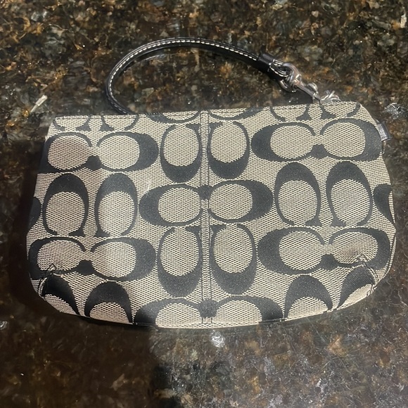Coach Wristlet approximately 7.5 inches long by 5 inches wide. Good condition. - Picture 2 of 6